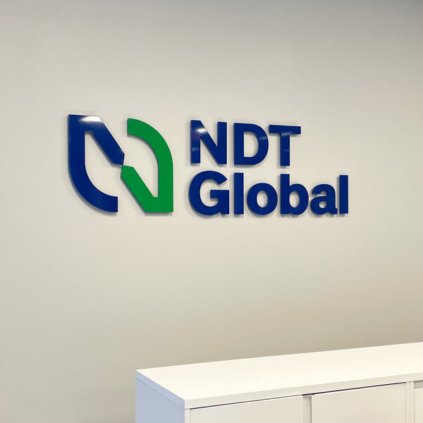Lobby sign for NDT Global in Edmonton 
